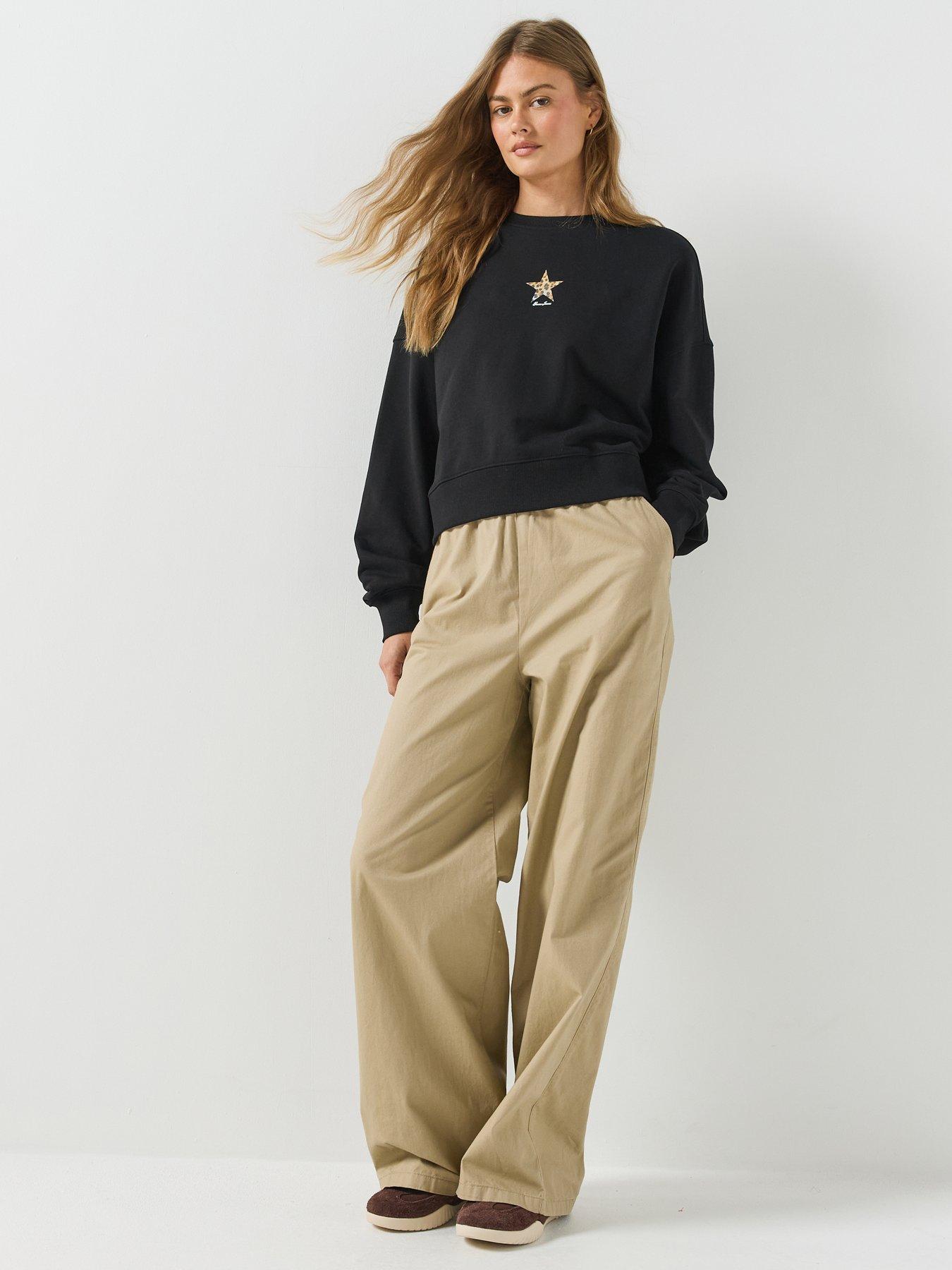 Image 3 of 6 of Guess Jeans Cropped Drop Shoulder Leopard Top - Black