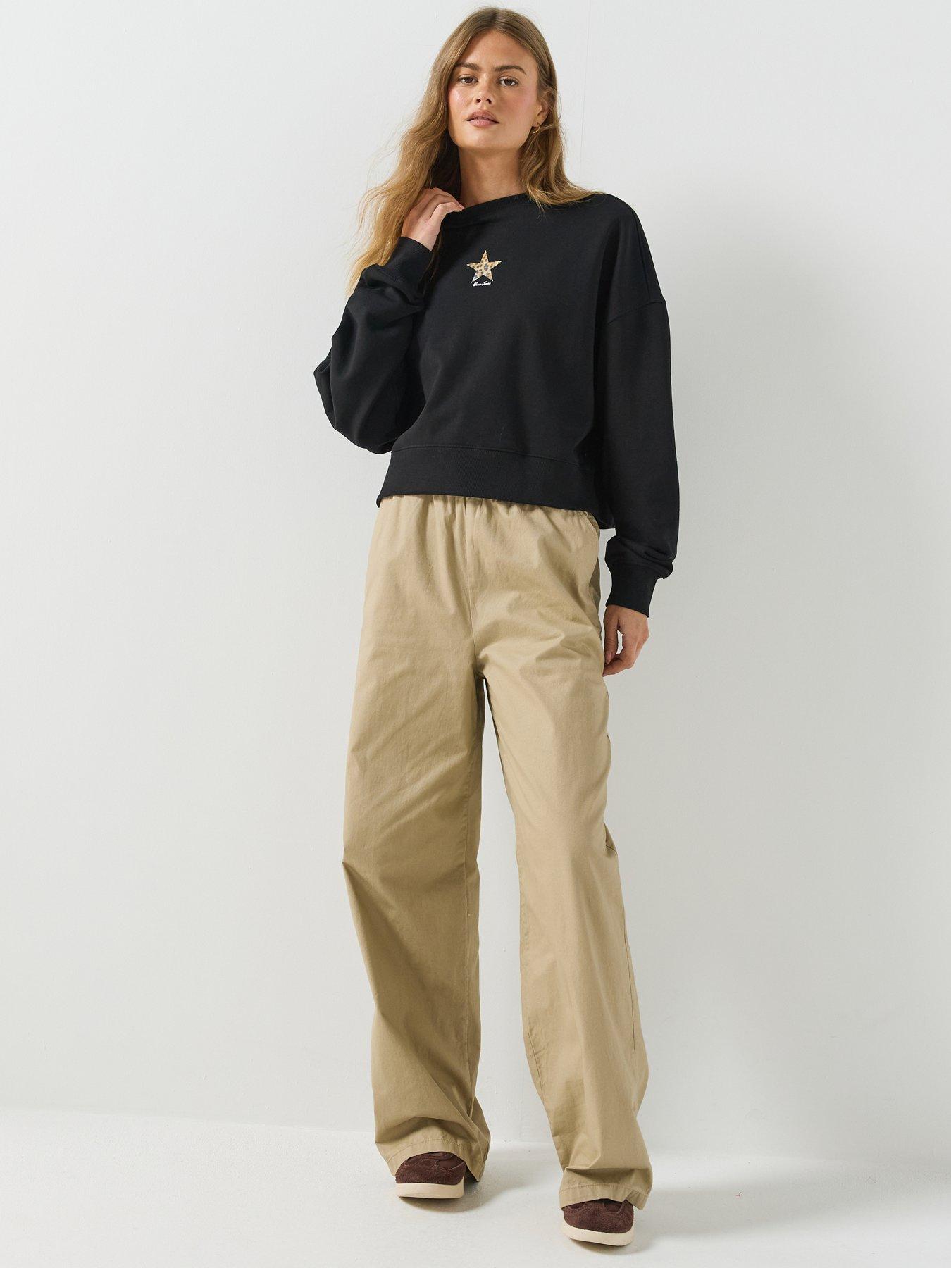 Image 6 of 6 of Guess Jeans Cropped Drop Shoulder Leopard Top - Black