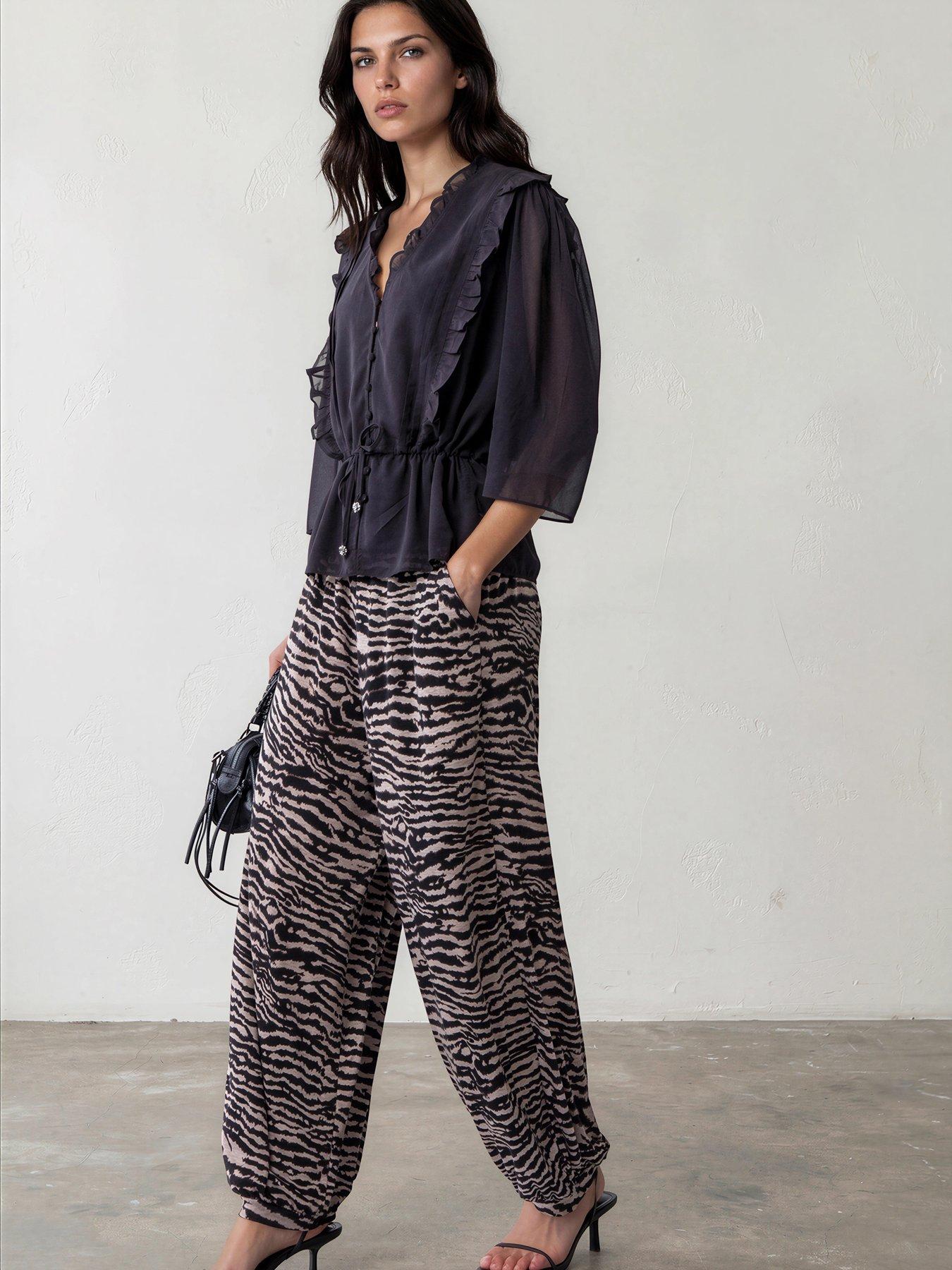 Image 2 of 7 of Religion Loose Fitting Lyla Jersey Trouser In Zebra Print With Cuffed Hem - Beige