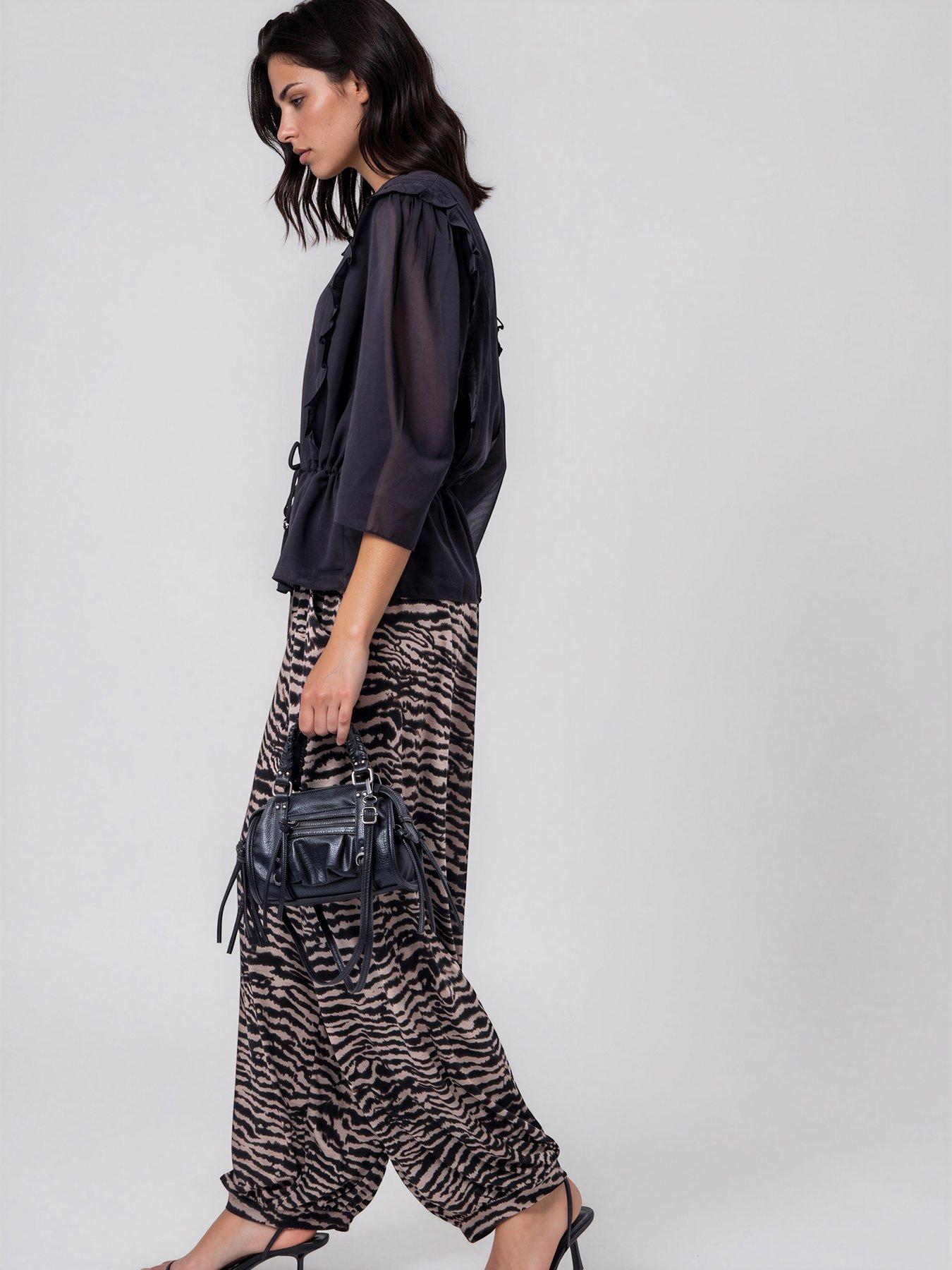 Image 4 of 7 of Religion Loose Fitting Lyla Jersey Trouser In Zebra Print With Cuffed Hem - Beige