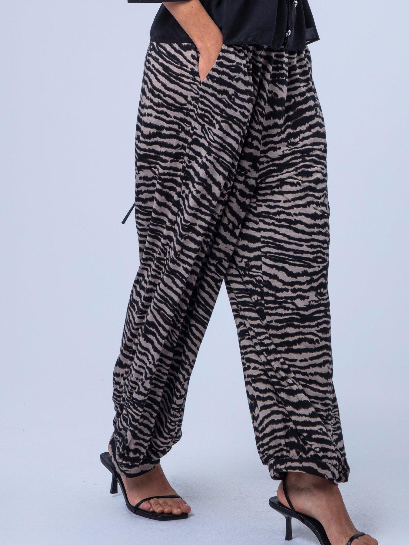 Image 5 of 7 of Religion Loose Fitting Lyla Jersey Trouser In Zebra Print With Cuffed Hem - Beige