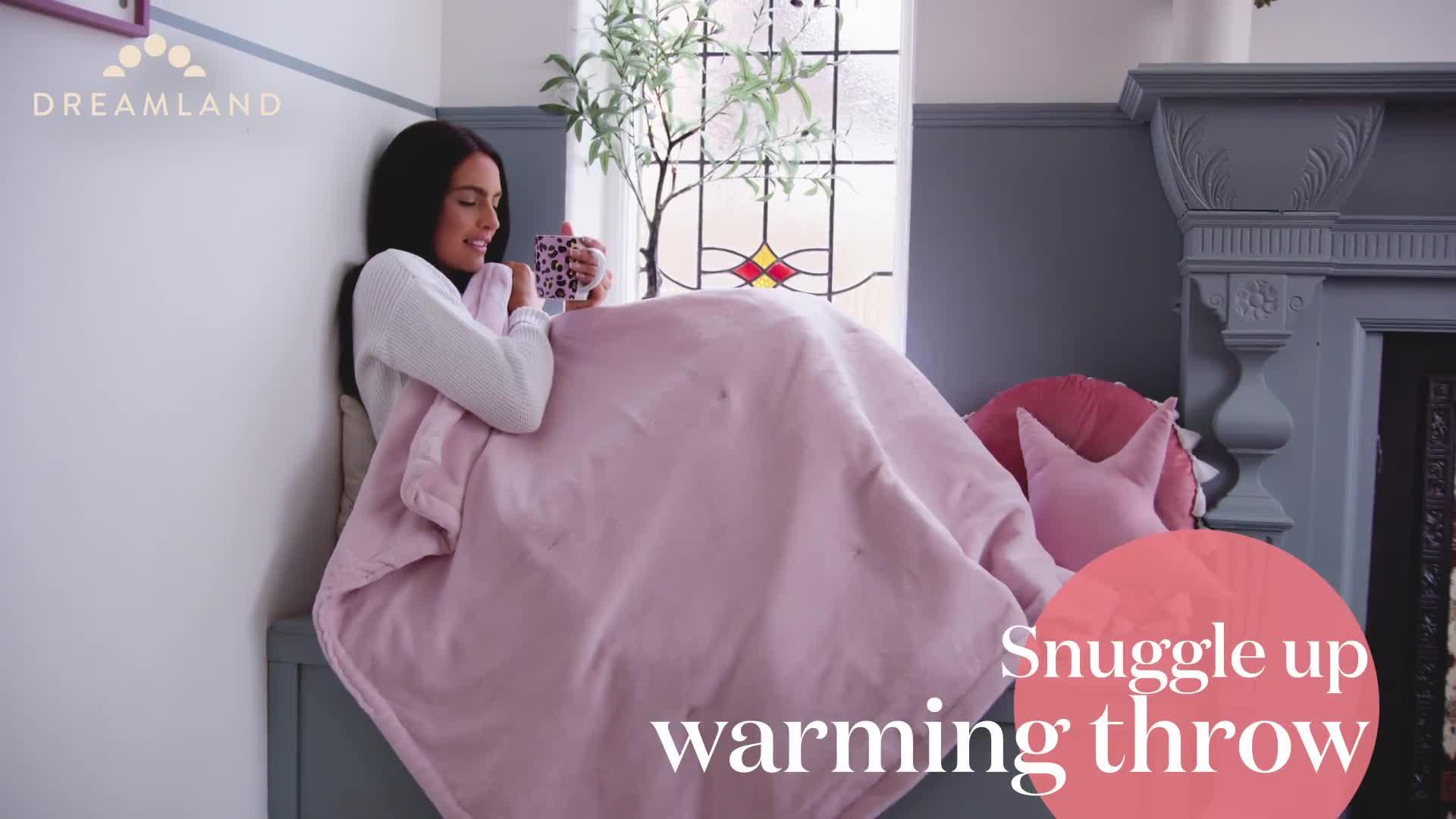 Video of dreamland-snuggle-up-warming-throw-pink