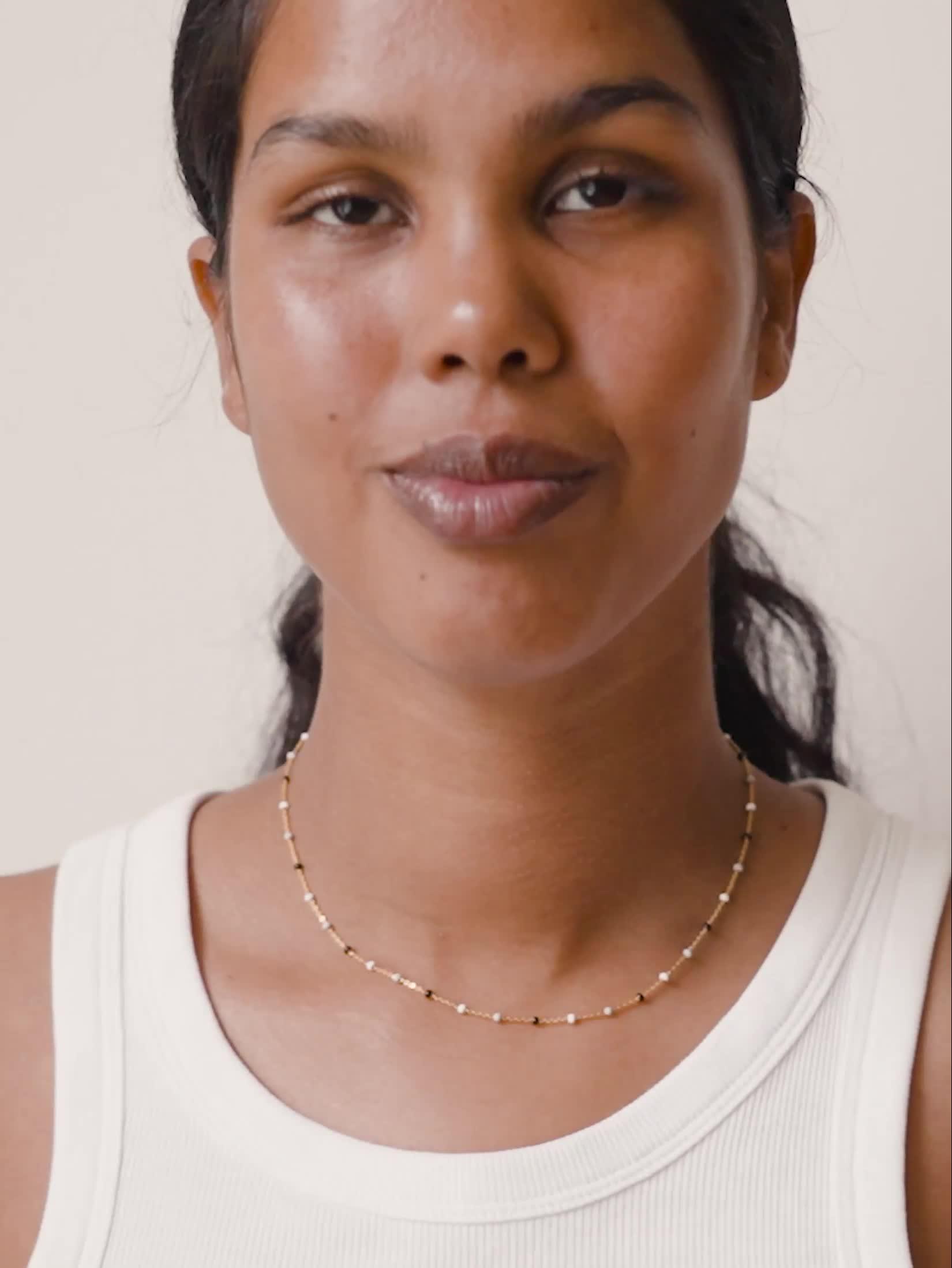Video of enamel-copenhagen-lola-gold-40cm-necklace-18ct-gold-plated-925-sterling-silver-and-black-and-white-enamel